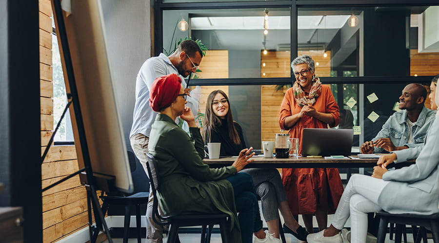 Diverse team of professionals engaged in a meeting Diverse team of professionals engaged in a meeting